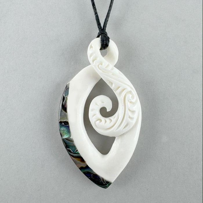 Maori Bone Twist Pendant with Inner Koru and Paua Trim - ShopNZ